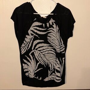 Maurice’s flowy black and white top.